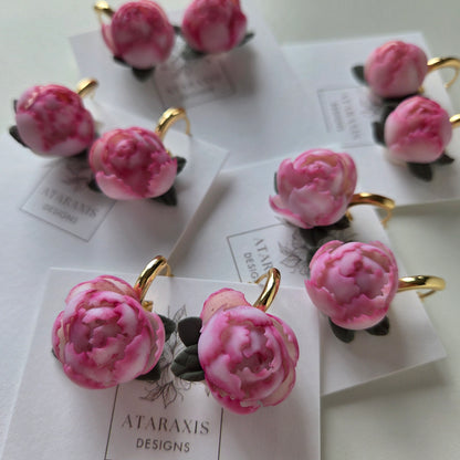 Pink floral earrings on Ataraxis Designs cards with a white background